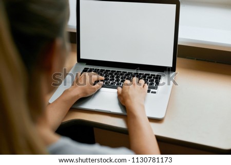  Cropped portrait of female employee typing on keyboard on generic laptop, working on financial report in office. Businesswoman checking e-mail sitting at table
