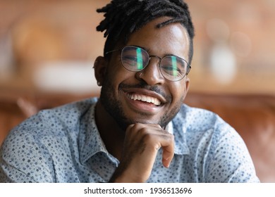 Cropped Portrait Of Happy Young African Male In Glasses With Dreadlocks Stubble Show Strong Healthy Teeth In Wide Smile. Headshot Of Handsome Black Man Hipster Part Of New Generation Looking At Camera