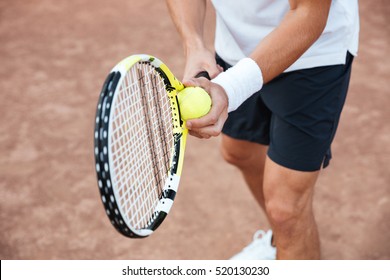 Cropped Portrait Of Tennis Player On Court. Tennis Man