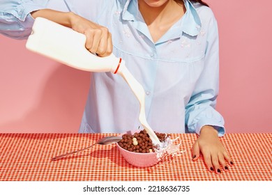 Cropped portrait of woman making cornflakes with milk. Retro 80s, 70s style. Complementary colors, Concept of art, beauty, minimalism. Food art photography
