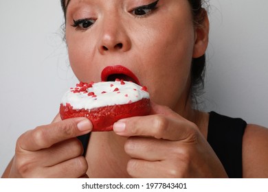 Cropped Portrait Of Young Woman Biting Sweet Donut. Isolated.