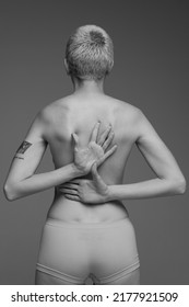 Cropped Rear View Image Of Female Back And Buttocks. Black And White Photography. Medical Care, Massage. Concept Of Beauty, Body And Skin Care, Health, Plastic Surgery, Medicine, Cosmetics, Ad