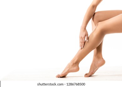 Cropped Shot Of African American Woman Touching Beautiful Smooth Leg On White