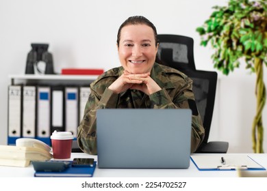 Cropped shot of an attractive young female soldier in her office and looking at camera - Shutterstock ID 2254702527