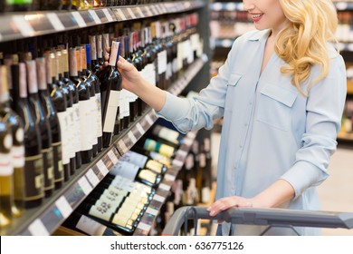 Cropped Shot Of A Beautiful Happy Woman Shopping At The Supermarket Walking With A Shopping Cart Taking Wine Bottle From A Shelf Copyspace Buying Consumer Consumerism Shop Store Winery Alcohol Concept