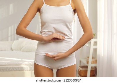 Cropped Shot Of A Beautiful Slim Young Woman In Underwear Forming A Circle With Her Hands On Her Belly. Concept Of Healthy Nutrition For Body, Stomach, Colon And Whole Digestive System Health