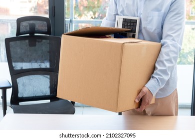 Cropped Shot Of A Businessman Leaving Work With A Box With His Objects At Office