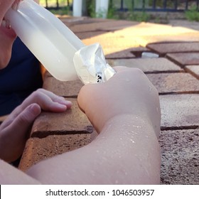 Cropped Shot Of Child Eating Lemonade Ice Block.