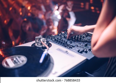 Cropped Shot Of A DJ Playing Music At The Club