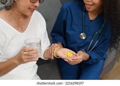 Cropped Shot Of Elderly Woman Taking Daily Medicine. Elderly Healthcare, Pharmaceutical Concept