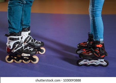 cropped shot of father and daughter in roller skates on roller rink - Shutterstock ID 1030093888