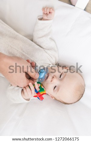 Similar – Baby asleep while parents caress