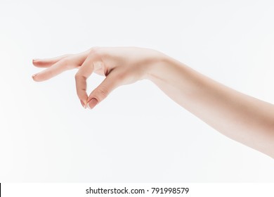 Cropped Shot Of Female Hand With Pinch Gesture Isolated On White