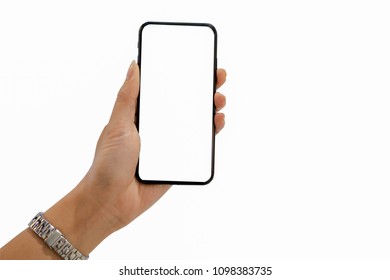 Cropped shot of female hand wearing silver watch holding blank screen phone white background. - Shutterstock ID 1098383735