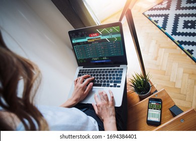 Cropped shot of female hands typing on keyboard. Girl using her laptop for making sport bets online at the bookmaker's website. - Powered by Shutterstock