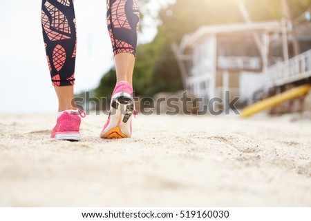 Similar – Image, Stock Photo pair of female beach slippers and a pink towel