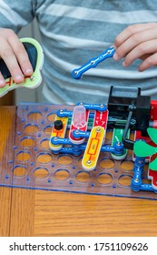 Cropped Shot Of A Girl Building A Robot Details Close Up Education Science Technology Robotics Futuristic Electronic Mechanic Developing Creativity Constructor Playing Toys Concept. Toned