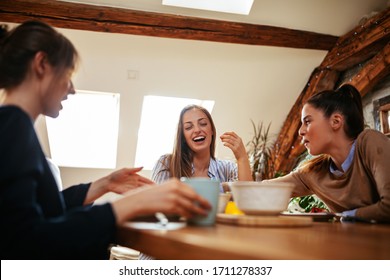 Cropped shot of a group of female friends having a breakfast - Powered by Shutterstock