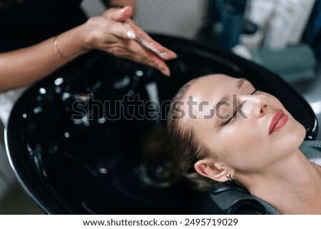 Similar – Image, Stock Photo Cropped unrecognizable female hairstylist using electric trimmer on male client’s hair at salon