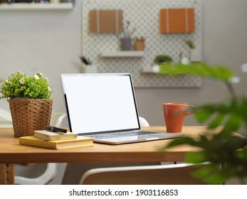 Cropped Shot Of Home Office Desk With Laptop, Stationery, Supplies And Decorations, Clipping Path