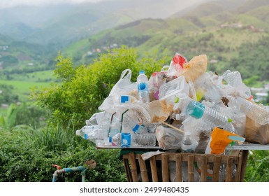 Cropped shot of lots waste bin  and garbage plastic bags over nature background. Many trash waste plastic bags, pollution garbage waste concept.