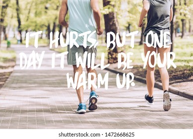 Cropped Shot Of Man In Woman Jogging Together Along Walkway In Park With It Hurts, But One Day It Will Be Your Warm Up Lettering