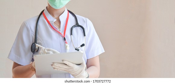 Cropped Shot Of Nurse Search For Patient Information On Tablet.