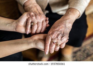 Cropped Shot Of A Senior Woman Holding Hands With A Nurse