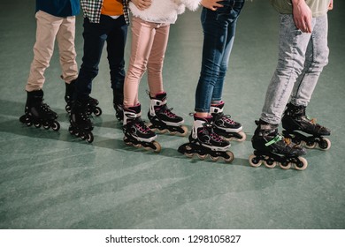 Cropped shot of several kids skating on rink - Shutterstock ID 1298105827