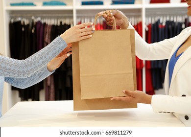 Cropped Shot Of A Shop Assistant Handing Shopping Bags To A Female Customer Copyspace Buying Buyer Seller Sale Discount Offer Giving Consumerism Purchasing Business Lifestyle Clothing Boutique