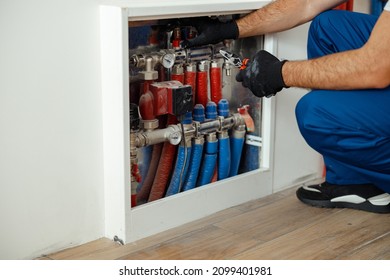 Cropped Shot Of Technician, Plumber In Protective Gloves Checking Water Pipes And Meter Counter