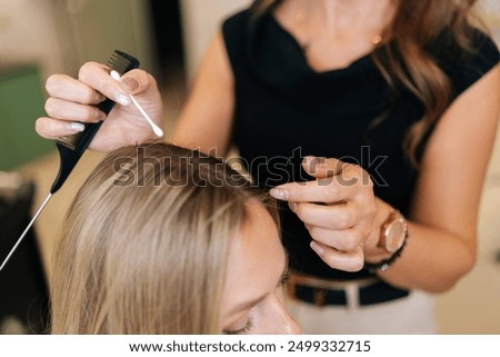 Similar – Image, Stock Photo Cropped unrecognizable female hairstylist using electric trimmer on male client’s hair at salon