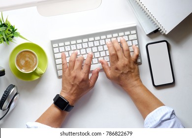 Cropped Shot Of An Unrecognizable Hands On Computer Keyboard On Workspace Table. Workplace. Top View