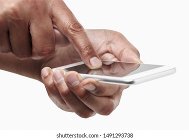 Cropped shot of an unrecognizable man hands writing with his thumbs on a mobile phone isolated on a white background