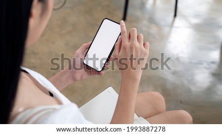cropped shot of woman hands holding blank screen smartphone.