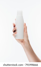 Cropped Shot Of Woman Holding Blank Bottle Of Lotion Isolated On White