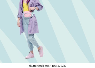 Cropped Shot Of Woman In Purple Trench Coat With Waist Pack