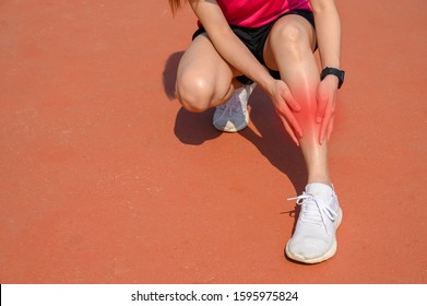 Cropped Shot Of Woman Runner Suffering Pain From Shin Splint. It Often Happens In The Front Or Inside Of The Lower Leg From Overtraining. Conceptual Of Common Running Injuries.