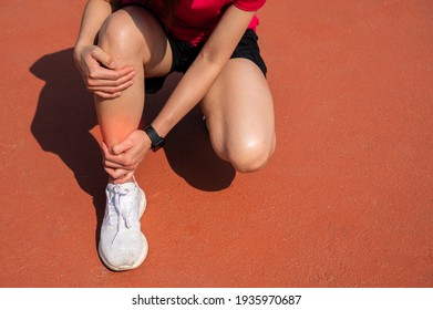 Cropped Shot Of Woman Runner Suffering Pain From Shin Splint. It Often Happens In The Front Or Inside Of The Lower Leg From Overtraining. Conceptual Of Common Running Injuries.