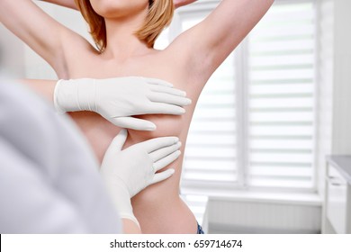 Cropped Shot Of A Woman Standing Topless Getting Her Breast Examined During Medical Appointment At The Hospital Copyspace Cancer Awareness Prevention Examination Checkup Medicine Health.