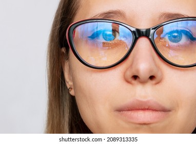 Cropped Shot Of Woman's Face With Red And Black Female Glasses For Working At A Computer With A Blue Filter Lenses Isolated On A White Background. Anti Blue Light And Rays. Eye Protection. Close-up