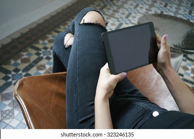 Cropped shot of a woman's hands using a digital tablet 