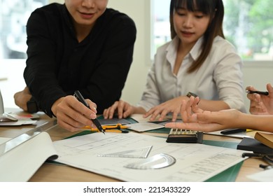 Cropped Shot Of Young Architects Collaborating On New Project Together In Architect Studio