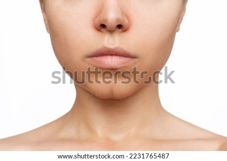Cropped shot of young caucasian woman with dimple on the chin isolated on a white background. Beauty concept