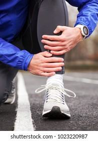 Cropped Shot Of A Young Runner Holding His Leg In Pain. Shin Splints.