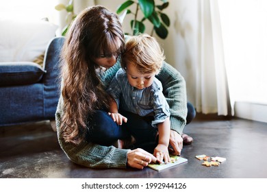 Cropped Shot Of A Young Woman Spending Quality Time At Home With Her Son