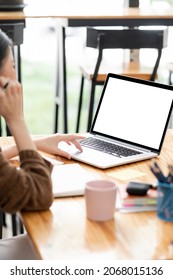 Cropped Shot Of Young Woman Using Laptop Computer, Mockup Blank Screen For Product Display, Rear View, Vertical View.