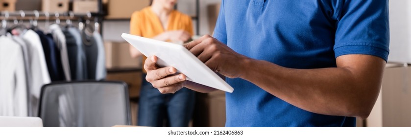 Cropped View Of African American Courier Using Digital Tablet In Online Web Store, Banner