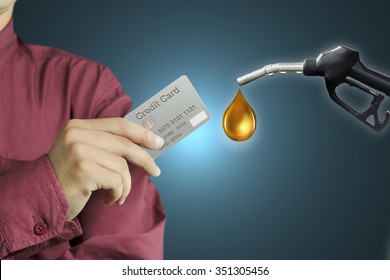 Cropped view of Businessman hand holding credit card in gas station