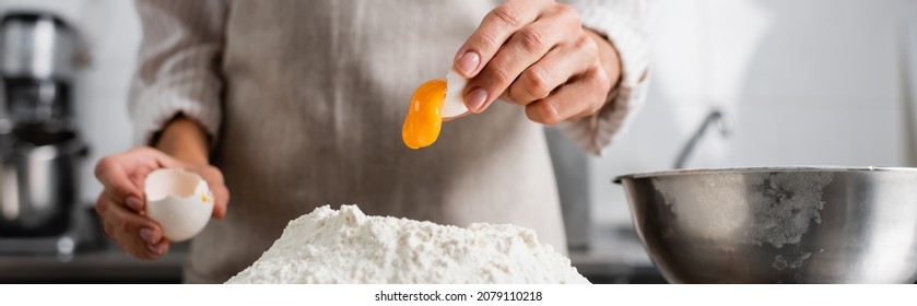 Cropped View Of Chef Pouring Egg Yolk On Flour In Kitchen, Banner